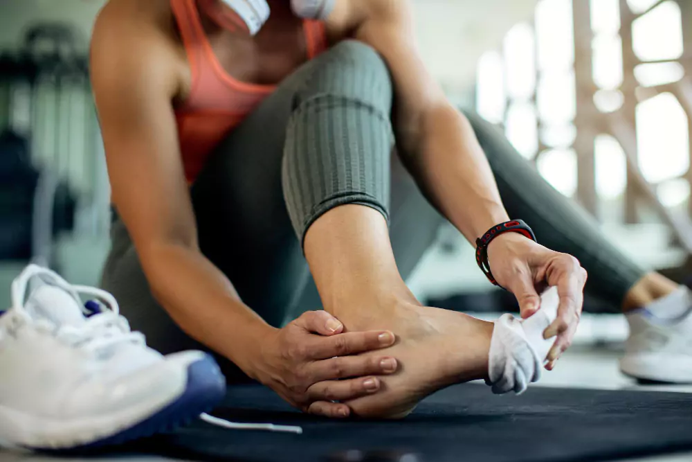 Athletic Woman Injured Her Foot During Workout