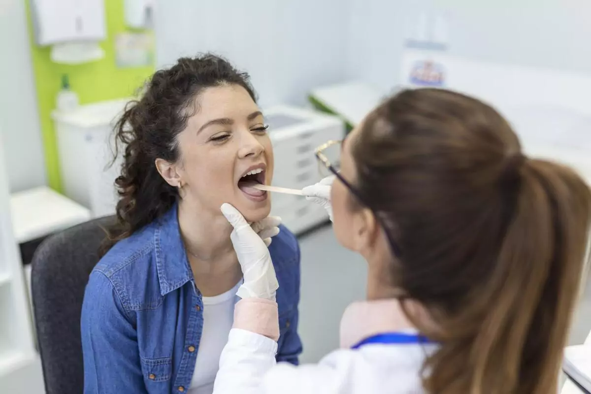 Female Patient Opening Mouth Doctor