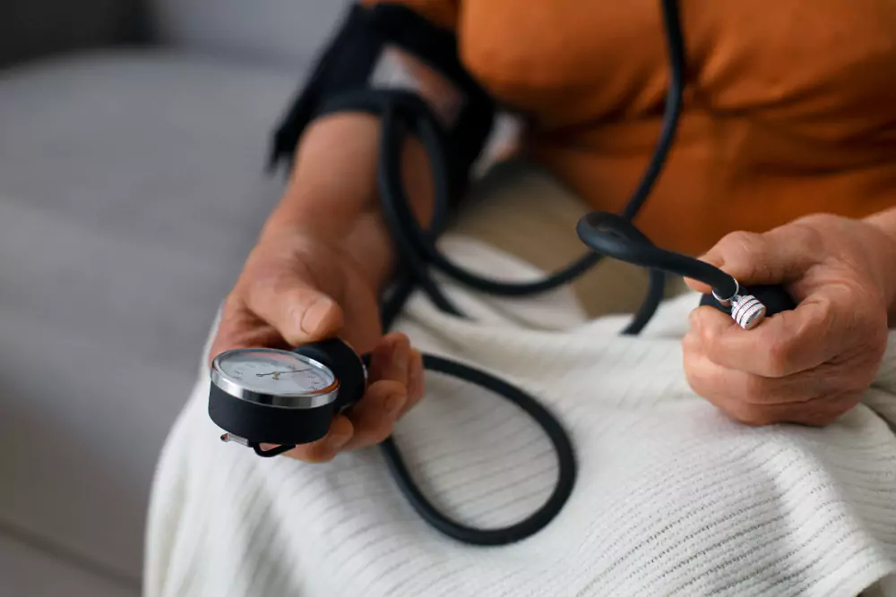 Person Checking Blood Pressure With Tensiometer